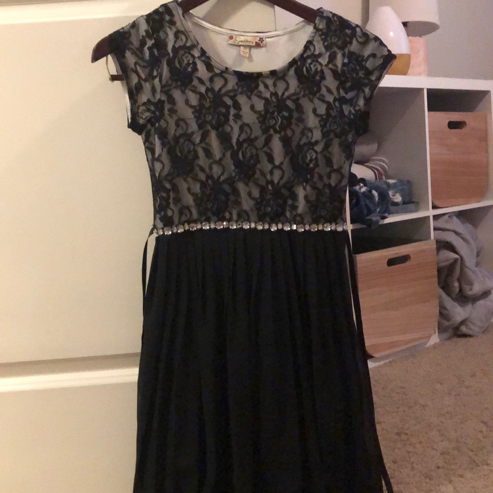 Black dress with lace flowers.